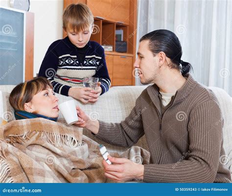 Man And Boy Caring For Sick Mother Stock Photo Image 50359243