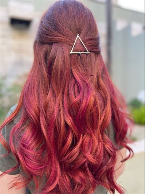 A Girl With Copper Red Hair And Hot Pink Highlights There Are Curls In