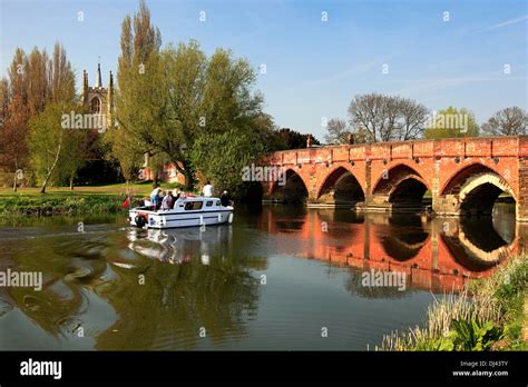 Boat And Bridge Over The River Great Ouse Great Barford Village