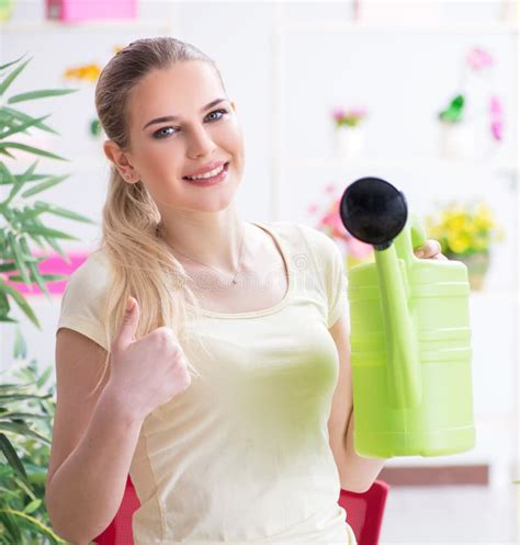 Young Woman Watering Plants In Her Garden Stock Photo Image Of Flower