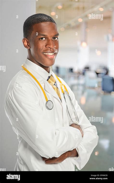Portrait Of African American Doctor Inside Hospital Building Stock