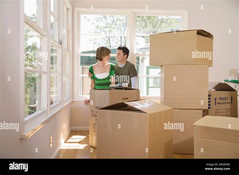 Couple Moving Into New Home Stock Photo Alamy