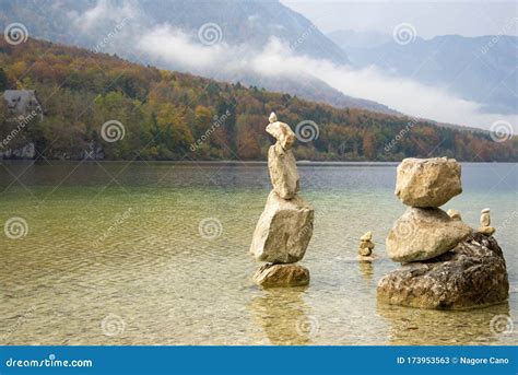 Stone Formations In A Lake With Trees And Mountains Stock Image Image