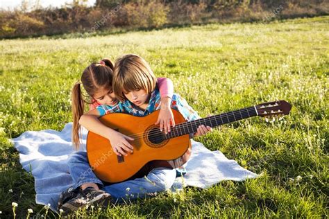 Children Play Guitar Stock Photo By ©panco 34125043