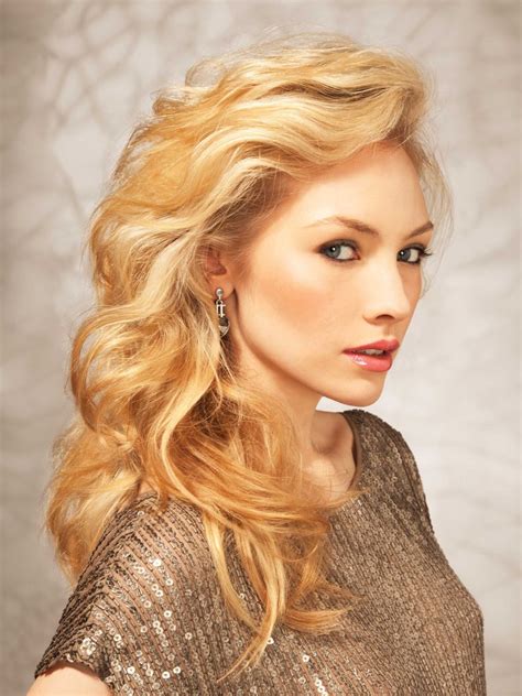 Honey blonde is a hair colour with a blend of light brown and sunkissed blonde with warm gold tones running through. Long golden blonde hair with a lifted side swept fringe