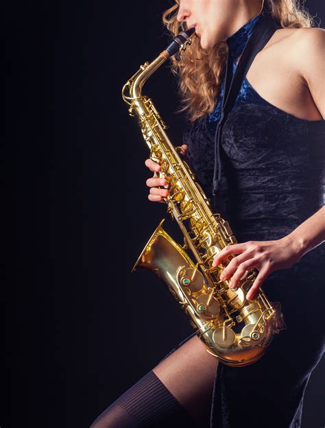 Saxophone Player Woman With Saxophone On A Dark Background Saxophone Gemusik Backgroud