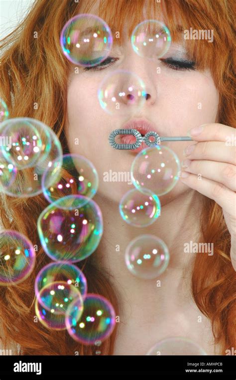 Young Woman Blowing Soap Bubbles Stock Photo Alamy