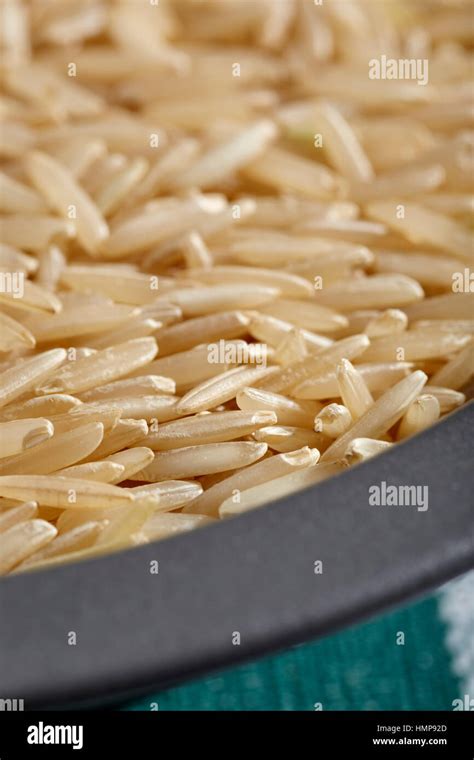 Uncooked Grains Of Brown Basmati Rice Stock Photo Alamy