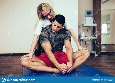 Physical Therapist Working With Male Patient Stock Image Image Of Doctor Nurse 220233437