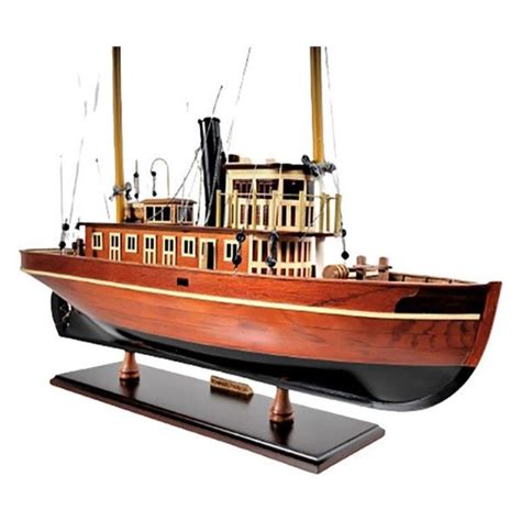 A Wooden Model Of A Boat On Display