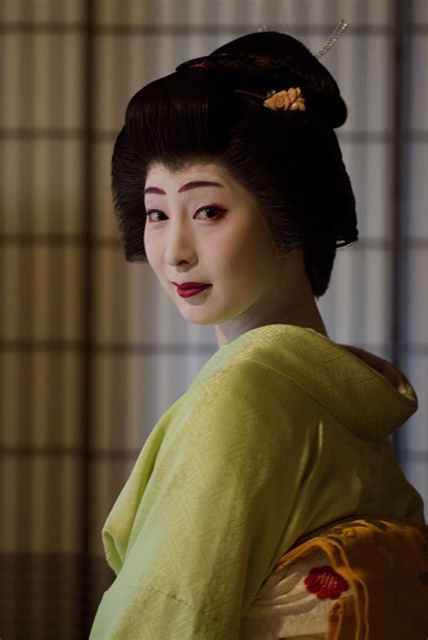 A Geisha Woman In Traditional Japanese Dress