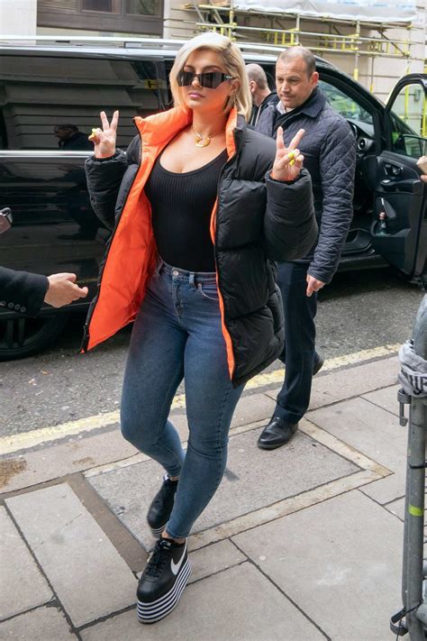 Bebe Rexha Rocks A Black And Orange Puffer Jacket Jeans With Nike Platform Sneakers As She