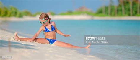 Girl Doing Splits On Beach High Res Stock Photo Getty Images