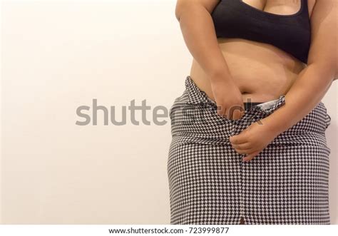 Overweight Woman Trying Fasten Her Skirt Stock Photo 723999877