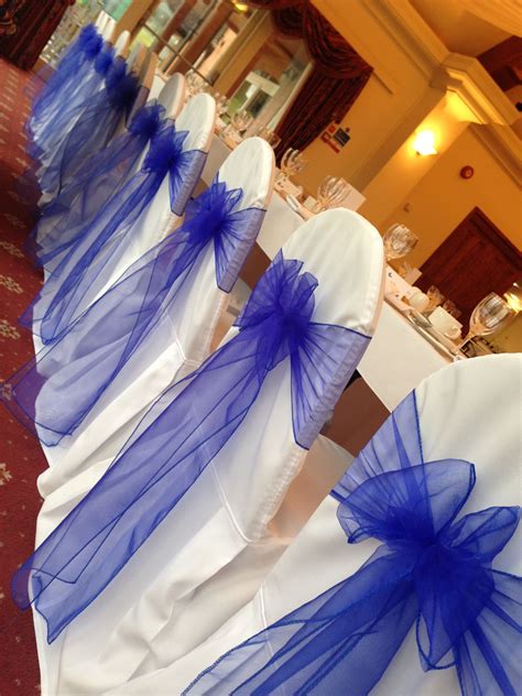 Chair Covers With Royal Blue Sashes Provided By Wedding Days To Amaze