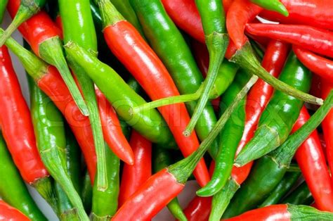 Red And Green Chili Peppers At The Background Stock Photo Colourbox