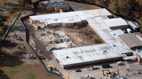 almost a year after massacre newtown begins razing sandy hook school the new york times