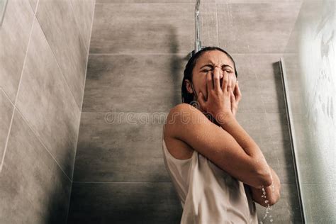 Sad Woman Crying In Shower At Home With Copy Space Stock Photo Image