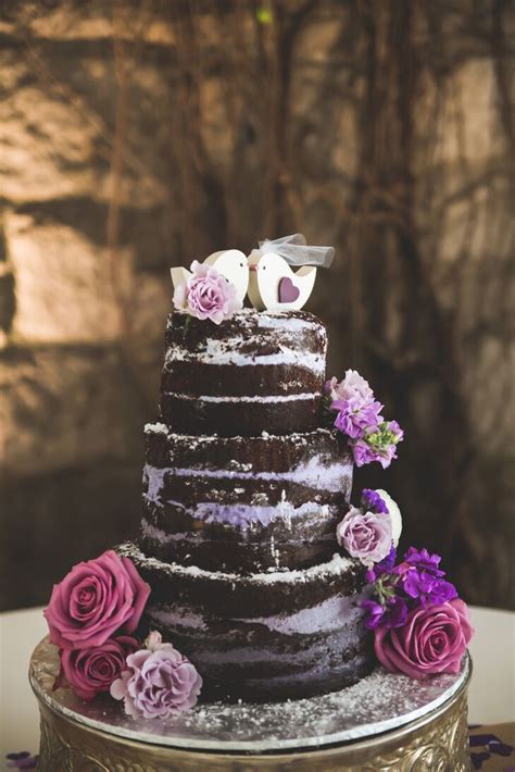 Dig into the best wedding cakes of all time! Naked Chocolate Wedding Cake With Purple Filling