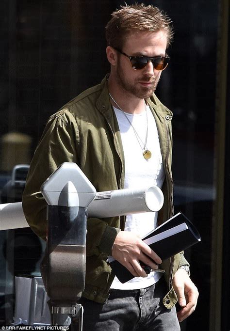 Carrying His Notebook Ryan Gosling Grips Rolled Up Booklet At Lunch