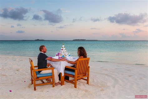 Matteo Colombo Travel Photography Couple Eating Dinner On The Beach