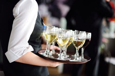 Waitress With Dish Of Champagne And Wine Glasses Stock Photo Image Of