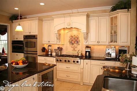 Ceramic blue or green cabinet hardware adds a touch of color. Tuscan Style Kitchen Oakhurst NJ by Design Line Kitchens