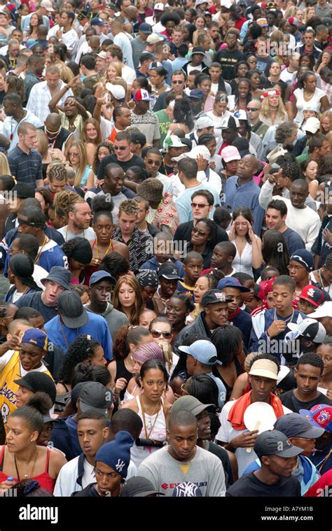 Large Multicultural Crowd Of People In The Streets Of Nottinghill At