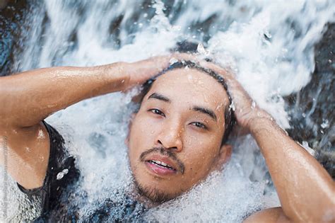 Young Asian Man Cooling Off On A Waterfall Stock Image Everypixel