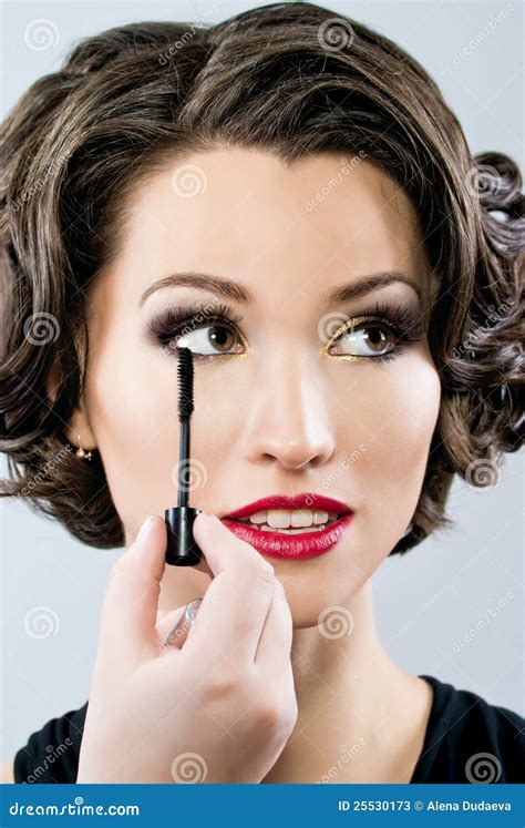 Woman Applying Mascara On Her Eyelashes Stock Image Image Of