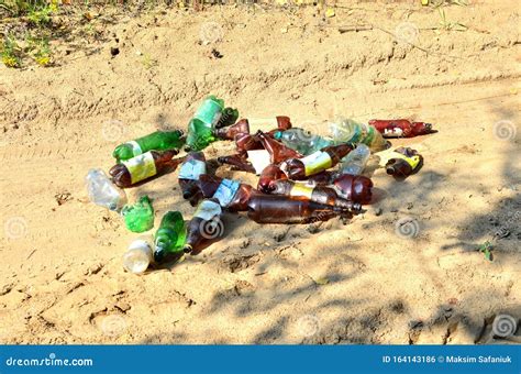 Empty Plastic Bottles Of Beer And Drinks People Throw On The Ground