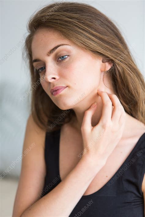 Woman Scratching Her Neck Stock Image C0347776 Science Photo Library