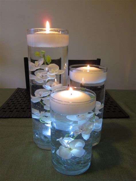 Vases With Floating Candles And Flowers