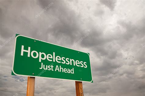 Hopelessness Green Road Sign Over Storm Clouds Stock Photo By