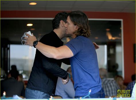 Jude Law And Mark Wahlberg Hug It Out While Bumping Into Each Other At