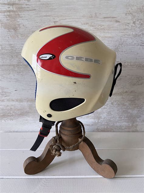 Helmet definition, any of various forms of protective head covering worn by soldiers, firefighters, divers, cyclists, etc. Vintage Ski or Snow Board Helmet by CEBE, Made in France