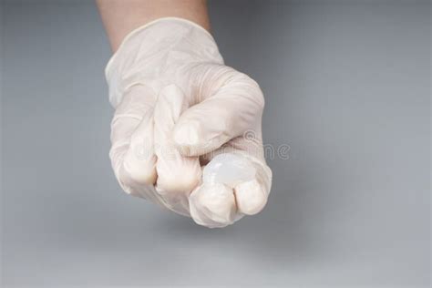 urologist appointment concept lubricant on the fingers of a doctor in gloves massage prostate