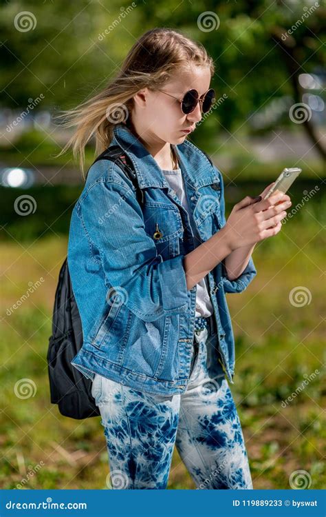 A Teenage Girl Is Holding A Smartphone Summer In Nature After School Stock Image Image Of