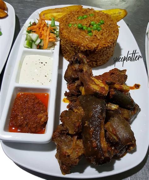 Smokey Party Jollof Rice With Peppered Goatmeat Available On Our Take