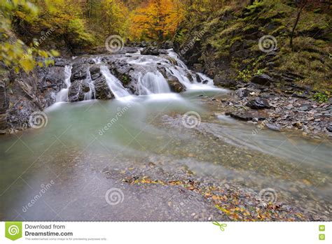 Beautiful Waterfall In Forest Autumn Landscape With Lots