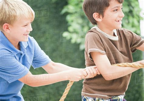 Boys Pulling Rope Together Stock Photo Dissolve
