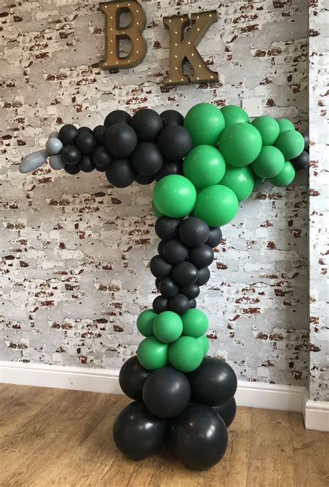 The Number One Balloon Is Made Up Of Black Green And White Balloons In
