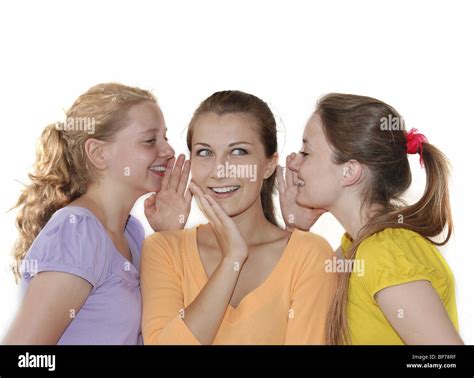 Friends Telling Secrets Over White Background Stock Photo Alamy