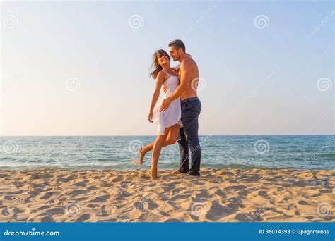 Young Couple Teasing One Another At The Beach Stock Image Image Of Female Playful 36014393