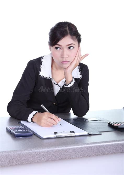 Business Woman Sitting On Her Desk And Thinking With Documents S Stock
