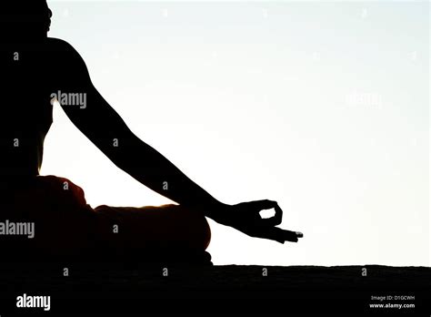 Sunset Silhouette Indian Man Meditating Hi Res Stock Photography And
