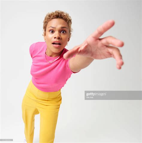 Woman Reaching Hand Toward Camera High Res Stock Photo Getty Images Body Reference Poses