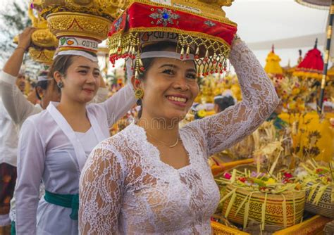 Beautiful Balinese Women Carrying Sacred Offerings On Their Heads In