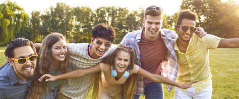Multiracial Group Of Happy Cheerful Funny Friends Having Fun Outdoors