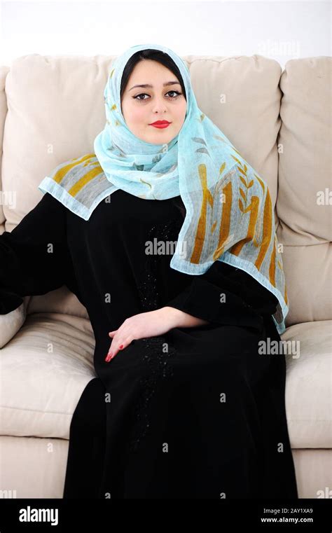 Arabic Woman Sitting On Sofa At Home Stock Photo Alamy